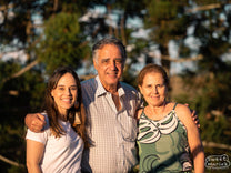 Carlos Henrique and family pose for a photo at Santa Rita de Cássia Farm. Daughter Dani left, and his wife at right.