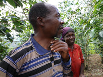 A photo of Isadore and Susana, small holder coffee farmers in Murambi Hill area, from our first visit in 2019.
