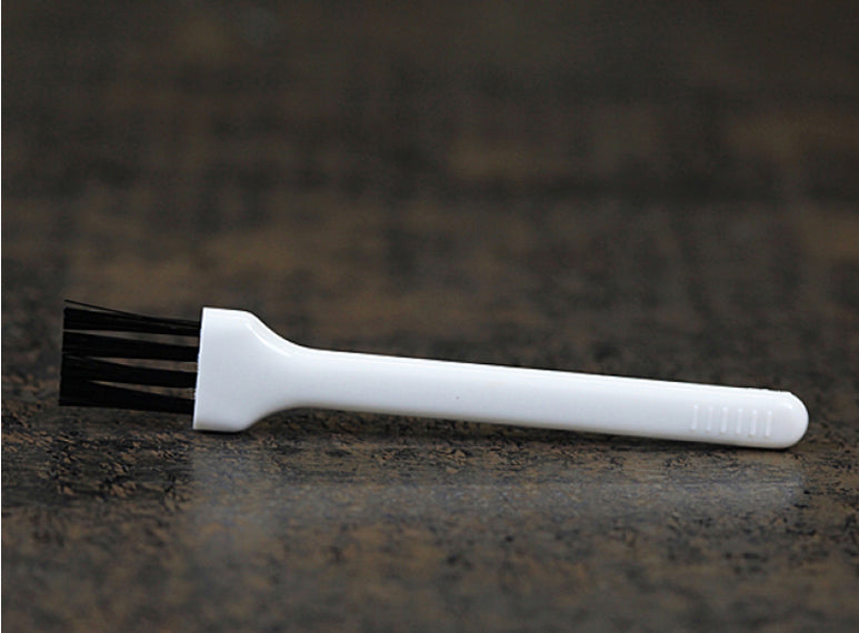 Includes plastic cleaning brush