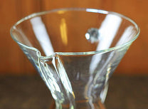 The 6 cup glass handle brewer has a capacity of 30 oz.