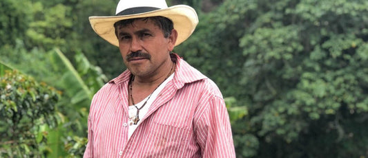 Alexander Mancilla poses for a photo at his coffee farm in Cajamarca, Tolima, Colombia.