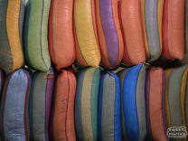 Colorful chiva bus driving through Buesaco town.