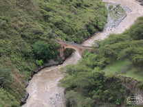 Looking down at the old stone bridge that spans a section of Rio Juanambú. Puente Juanambú, Buesaco, Nariño, Colombia.