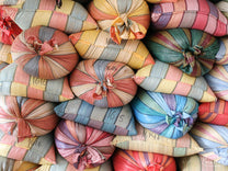 Colorful mylar bags filled with parchment coffee at the warehouse in Buesaco town, Nariño.