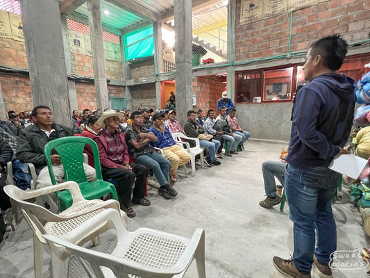 A payment ceremony at the warehouse in San Antonio town, where farmers are paid premium on top of the base price they received when selling their coffee. Inzá, Cauca.