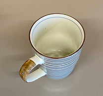  or just over 8 fluid ounces. The pattern is from a traditional kimono and the glazes are classic cobalt blue with a brown accent on the handle.