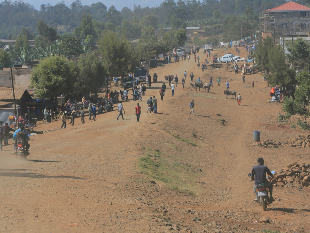 Driving down the dusty dirt road in Uraga town.