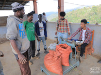 Coffee cherries are weighed on delivery at the Wote Konga mill.