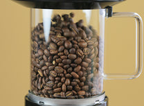 Close-up of beans circulating in the roast chamber. The SR800 supports 8 oz of beans per batch. 