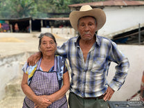 Rosalio Villatoro at right, with his wife Rosiela, at their green coffee wet mill near their home in Peña Blanca, Huehuetenango, Guatemala.