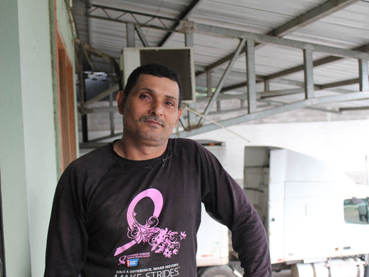 Coffee farmer Anibal Baca poses for a photo at the San Vicente mill in Santa Barbara, Honduras.