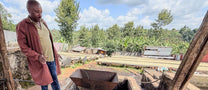 Farm manager, Moses, shows us the pulper and cement fermentation tank at Spike coffee farm in Kiambu, Kenya.