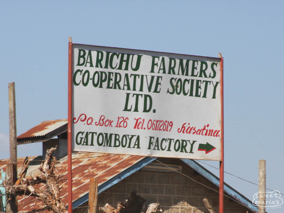 The painted sign at the entrance to the Gatomboya Factory, Nyeri, Kenya.