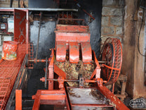 Disc pulper that removes the outer fruit from the green coffee seeds at the Gathaithi Factory, Nyeri, Kenya.