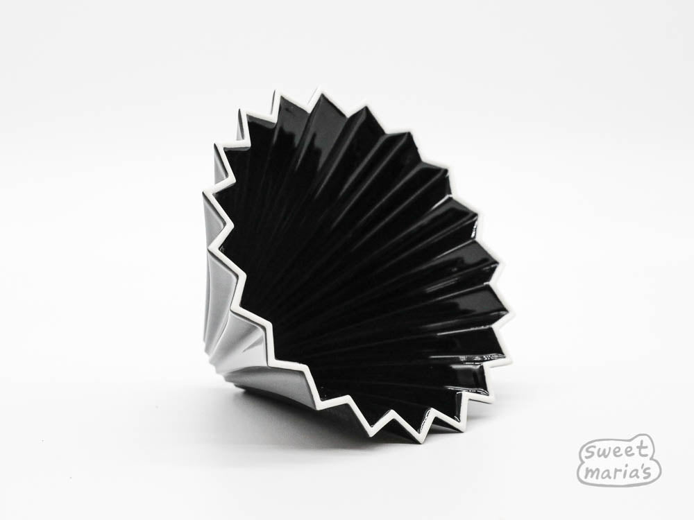 The Origami Ceramic Coffee Dripper, Size Medium, can use Hario V60 or Kalita Wave type filters