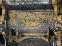 A close-up photo of a coffee pulper at a small Peruvian farm.