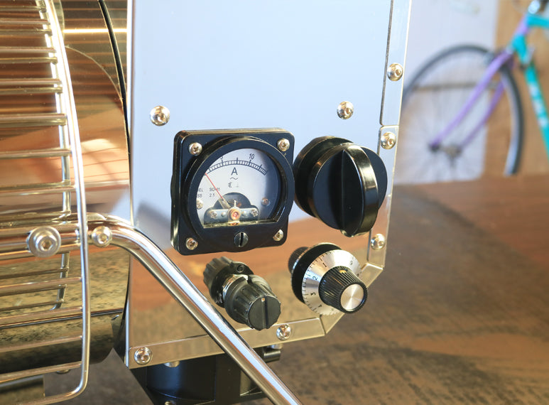 Add unroasted beans to the drum using the chute located in the rear of the Quest M3s
