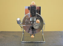 The Quest M6 electric coffee roaster has a faceplate that includes a weighted drop door
