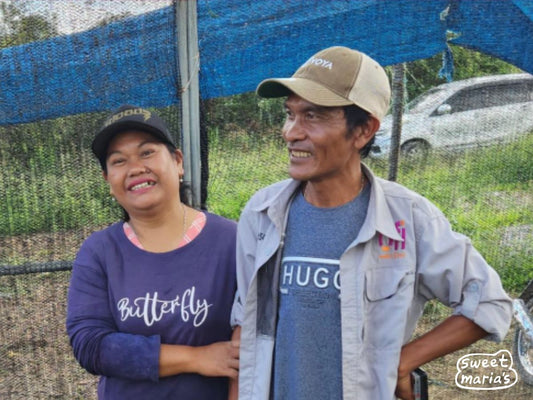 Coffee couple Pak Keiza (left) and Ibu Mega (right), who contributed to this coffee, at their processing site in Lintong.