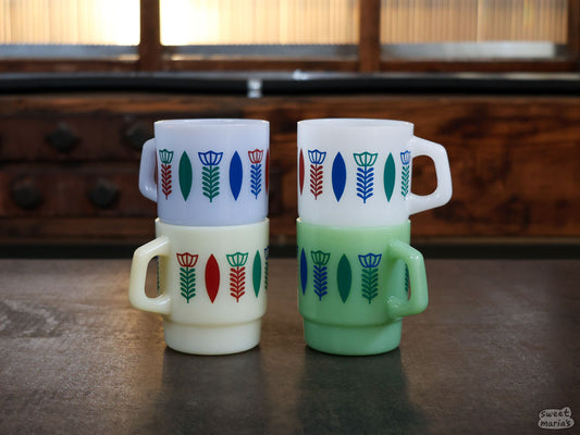 The Ethiopia Sini Design Glass Mugs are made of thick, opaque colored glass.