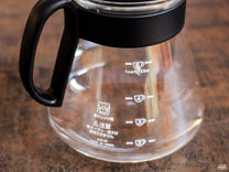 The Hario V60 Glass Carafe has several measurement labels on it