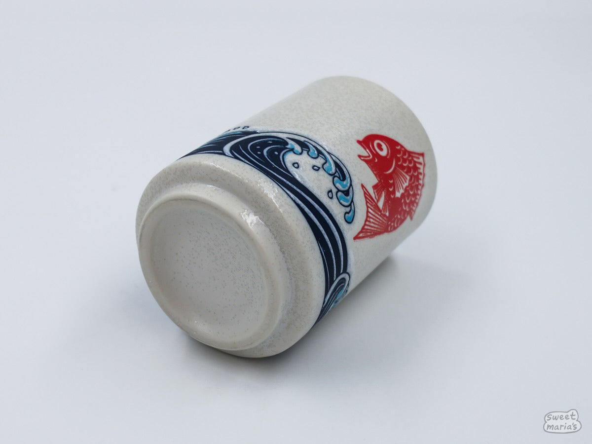The Red Seabream & Waves Cup can hold at most 8 oz of liquid.