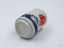 The Red Seabream & Waves Cup can hold at most 8 oz of liquid.