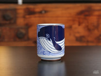 The Sad Whale Ceramic Cup holds about 8 oz of liquid.