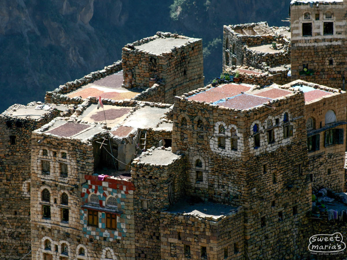 Coffee dries on the rooftops to create a colorful patchwork atop an already incredible stone city backdrop.